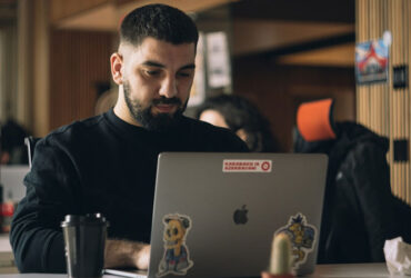 A male employee using faxing software with enhanced security and privacy features