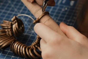 Person measuring finger with ring sizer tool for accurate ring sizing