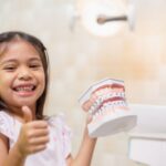 Little girl teeth are healthy in dental office, dental care