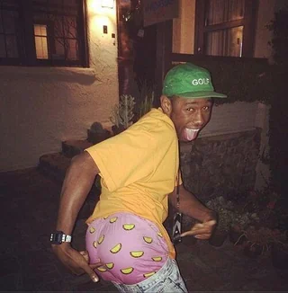Funny photo of Tyler the Creator showing peach print boxers and posing humorously — top 20 funny images online