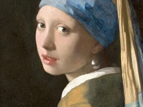 Girl with a Pearl Earring by Johannes Vermeer, a famous 17th-century painting depicting a young woman in an exotic turban with a large pearl earring, known for its captivating gaze and masterful use of light.