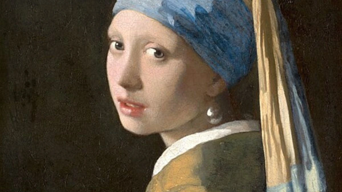 Girl with a Pearl Earring by Johannes Vermeer, a famous 17th-century painting depicting a young woman in an exotic turban with a large pearl earring, known for its captivating gaze and masterful use of light.