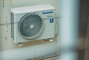 Outdoor air conditioning unit installed on building