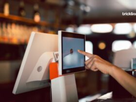 Women Hand doing process payment on touch screen cash register