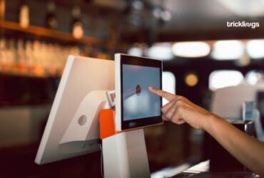 Women Hand doing process payment on touch screen cash register