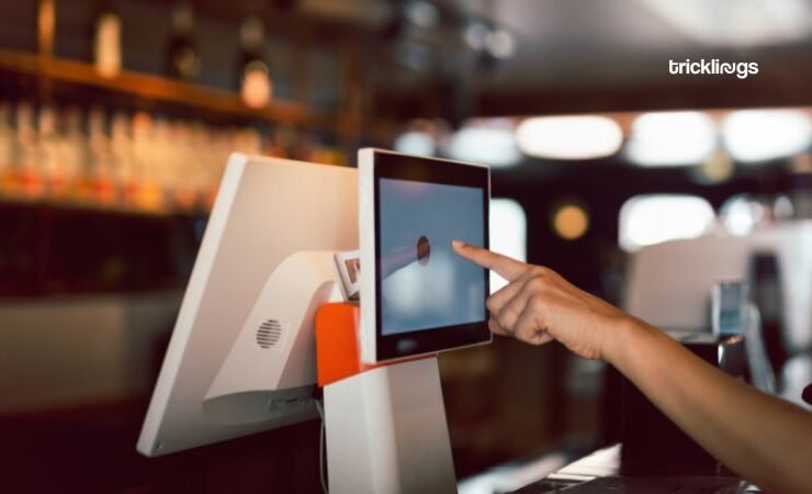 Women Hand doing process payment on touch screen cash register