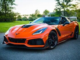 Photo by Garvin St. Villier - red sports car on a fancy road