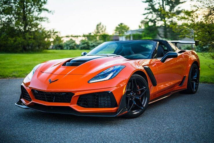 Photo by Garvin St. Villier - red sports car on a fancy road