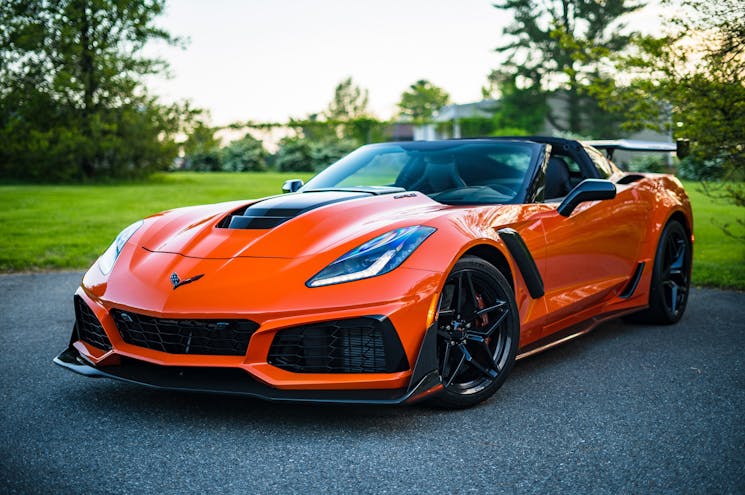 Photo by Garvin St. Villier - red sports car on a fancy road