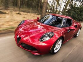 Red Alfa Romeo C4 on Road Near Trees