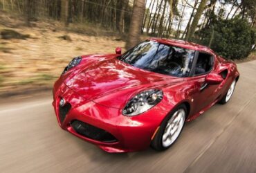 Red Alfa Romeo C4 on Road Near Trees