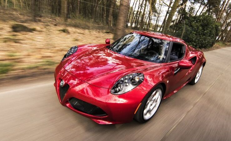 Red Alfa Romeo C4 on Road Near Trees