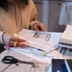 Representational: Person reading on Papers preparing for interview