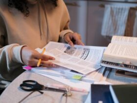 Representational: Person reading on Papers preparing for interview