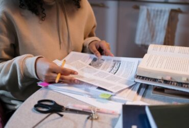 Representational: Person reading on Papers preparing for interview