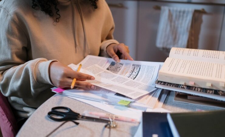 Representational: Person reading on Papers preparing for interview