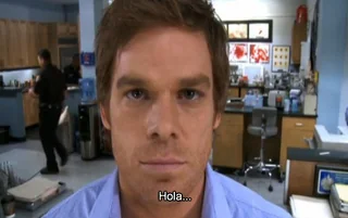 Screenshot of Dexter Morgan staring directly into camera with subtitle “Hola” — top 20 funny pictures online