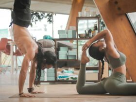 Photo by Carl Barcelo on Unsplash - woman stretching Two people doing yoga