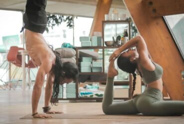 Photo by Carl Barcelo on Unsplash - woman stretching Two people doing yoga