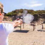 Women is doing Dry fire systems training in hot weather