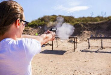 Women is doing Dry fire systems training in hot weather