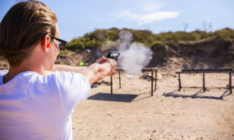 Women is doing Dry fire systems training in hot weather