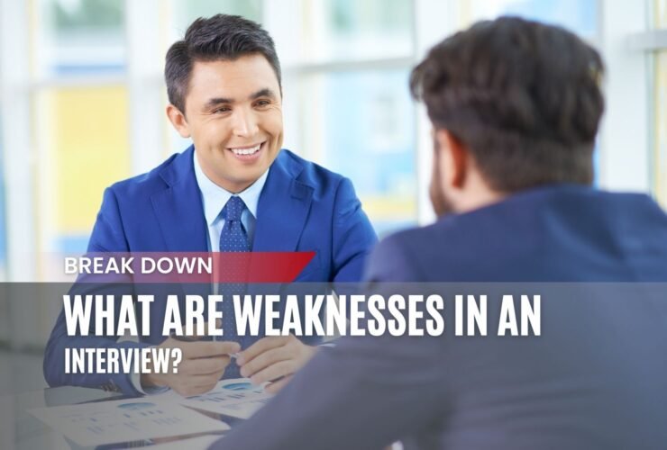 A professional job interview scene where a smiling interviewer in a blue suit is speaking with a candidate. The image features the text overlay: "Break Down - What Are Weaknesses in an Interview?"