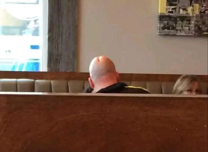 bald man’s head crease accidentally resembles something inappropriate from behind