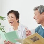 Cheerful Japanese seniors sharing memories in a supportive assisted living environment