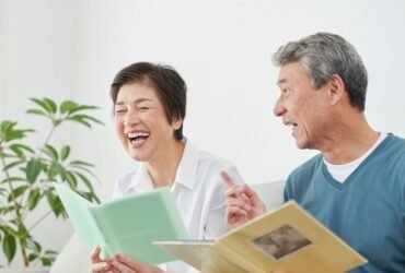 Cheerful Japanese seniors sharing memories in a supportive assisted living environment
