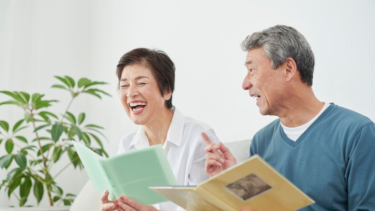Cheerful Japanese seniors sharing memories in a supportive assisted living environment