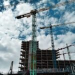 Green and yellow crane symbolizing cultural fluency in international construction work