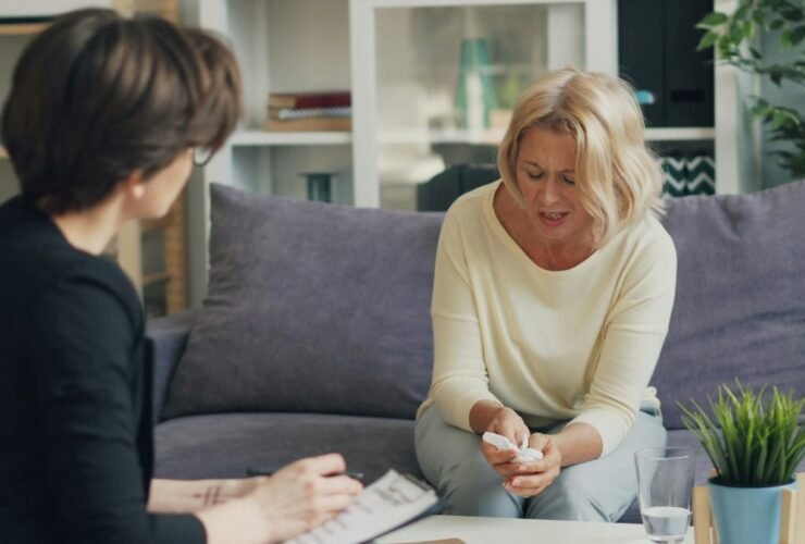 Two women talking during a mental health consultation session