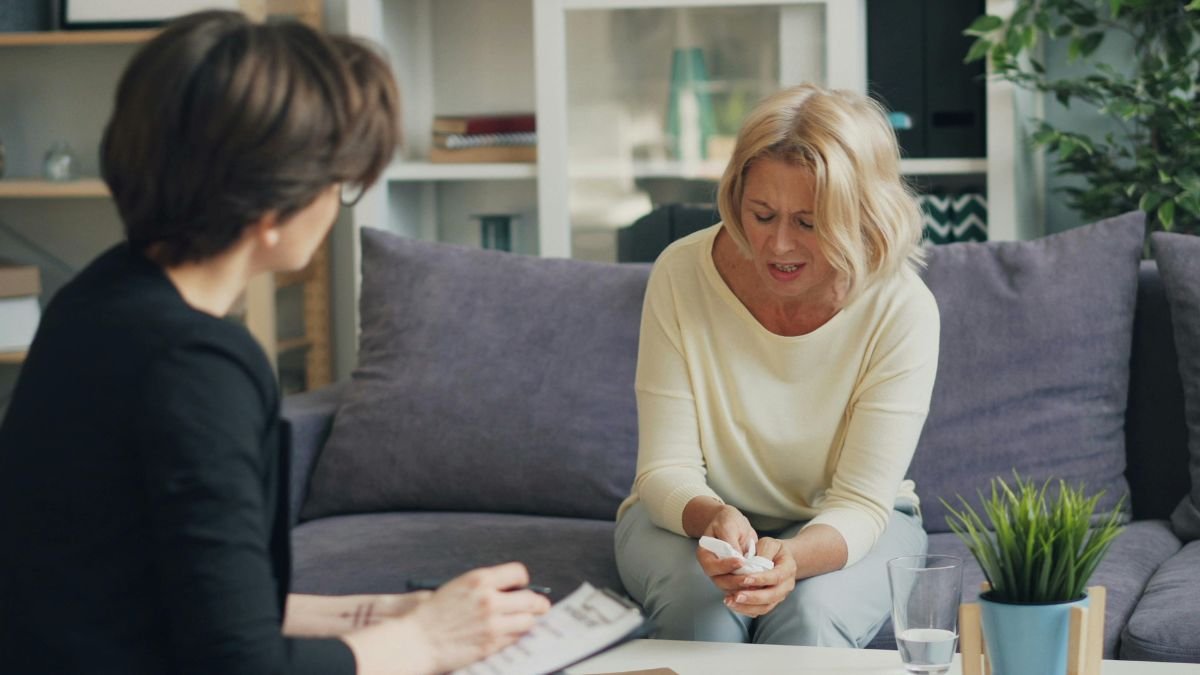 Two women talking during a mental health consultation session