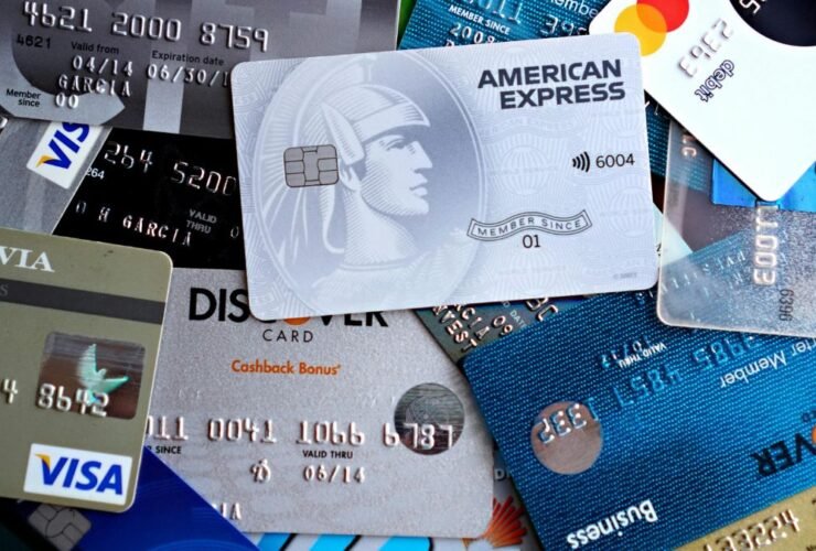 Stack of credit and debit cards representing debt consolidation