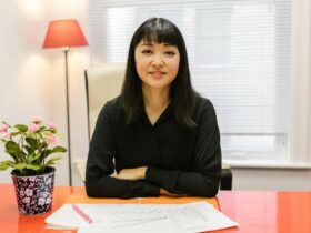 Woman reviewing business signage design at a table