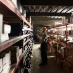 Man standing inside a warehouse representing emerging trends in business operations
