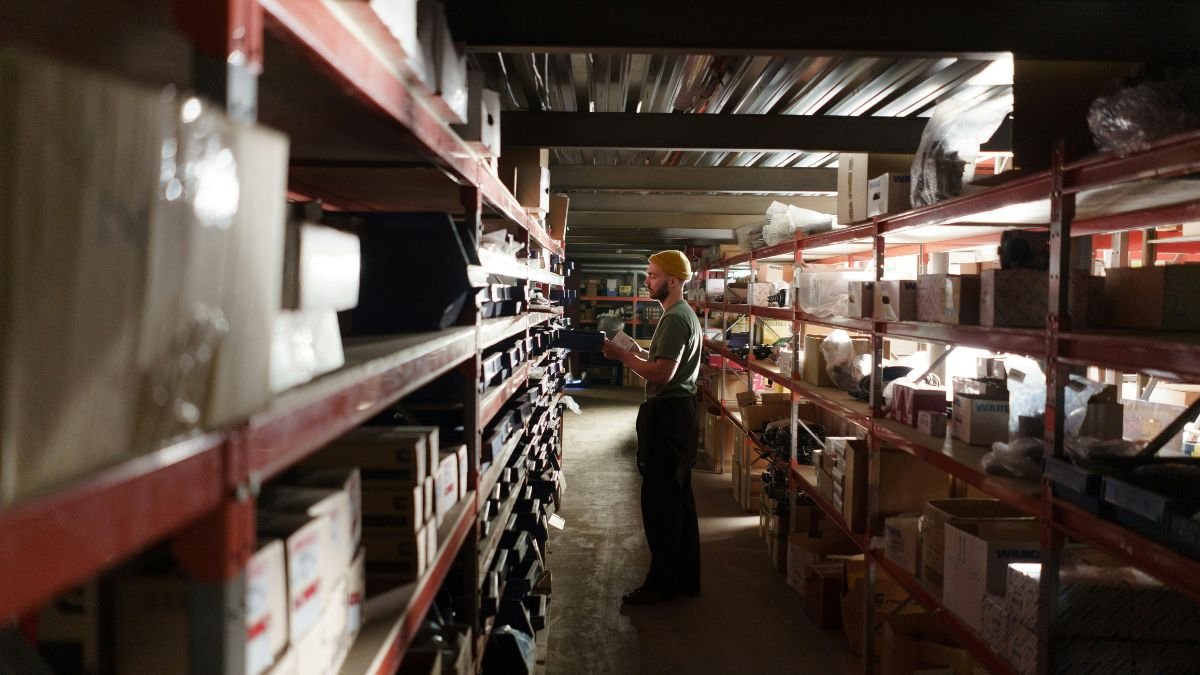 Man standing inside a warehouse representing emerging trends in business operations