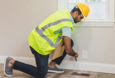 Man inspecting home flooring for hidden damage