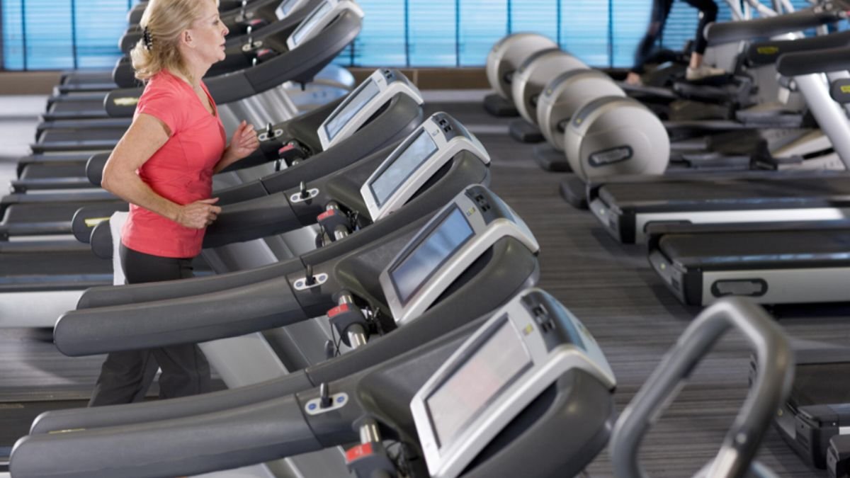 Senior man walking indoors for exercise to maintain health and independence
