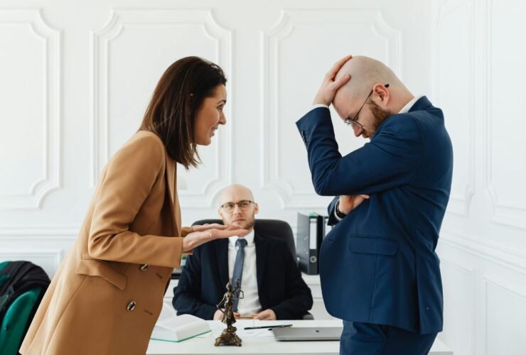 Couple consulting a land dispute lawyer about property issues