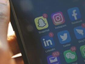 Smartphone screen showing social media apps for brand media alerts