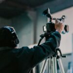 Man holding a camera symbolizing how ordinary brands capture extraordinary buzz