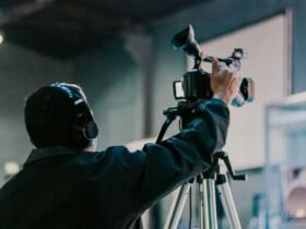Man holding a camera symbolizing how ordinary brands capture extraordinary buzz