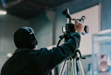 Man holding a camera symbolizing how ordinary brands capture extraordinary buzz