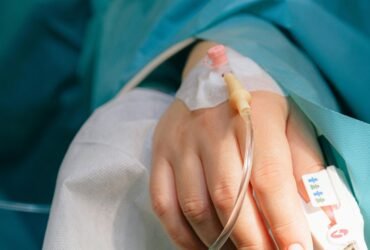 Patient receiving IV treatment in a clinical setting