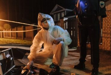 Photo by cottonbro studio - Forensics Investigator Talking to a Policewoman About the Found Evidence