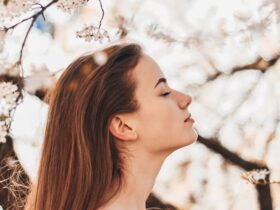 Woman in a stylish off-shoulder shirt, showcasing must-have spring and summer fashion for women
