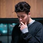 Wealthy man smoking alone in deep thought