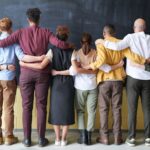 Photo by fauxels - Group of Employees Standing Indoors